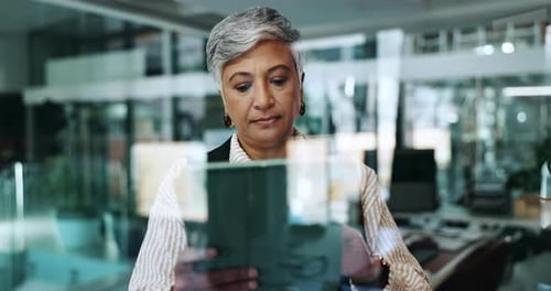 Businesswoman Using Tablet in Modern Office Space