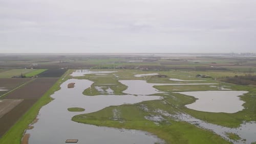 Flooded fields of Belgium, aerial drone view of moody day