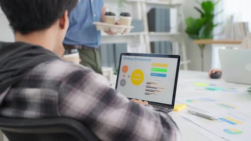 Close up of young businessman and woman people working in the modern corporate workplace.
