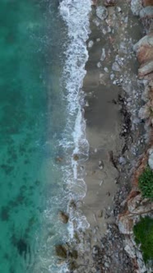 Vertical Video Aerial Sunrise Beauty Gaze at Mediterranean Sea's Morning Textures