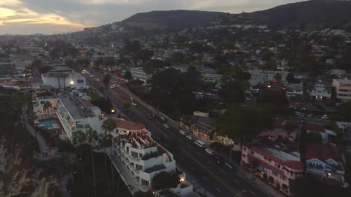 Downtown Laguna Beach, Driving on PCH at Night Sunset. Orange County, Southern California Coast, USA