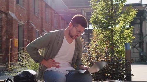 Businessman Suffering From Acute Stomach Pain Liver Pain Sitting on Bench