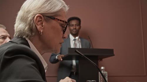 Business People Speaking at a Corporate Event