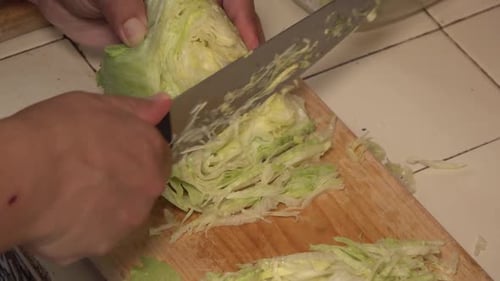 Cutting Lettuce on a Cutting Board