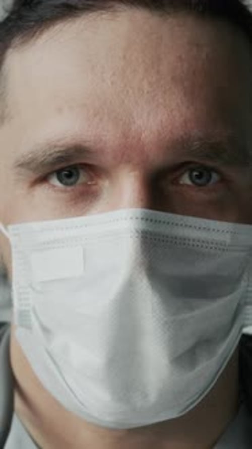 Vertical Portrait of Young Caucasian Male Nurse in Face Mask