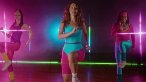 Women Exercising in Retro Outfits on Step Platforms