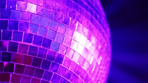 Disco Ball in Motion with Colorful Lights