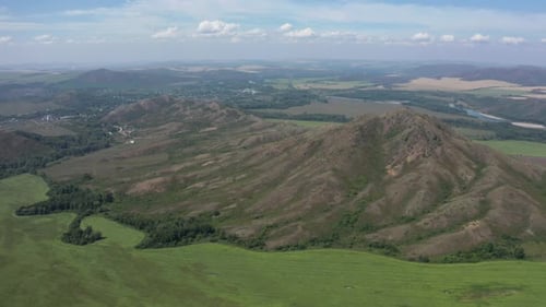 Aerial View of Green Fields and Rolling Hills