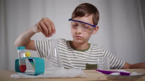 Boy Doing Science Experiment at Home