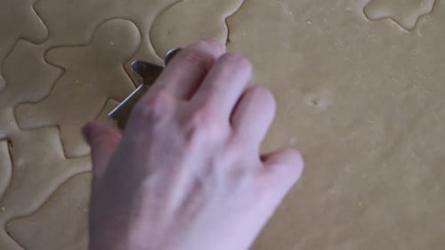 Cookie Dough Being Cut for Holiday Baking