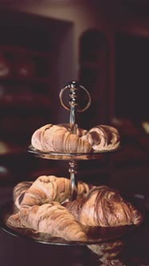 Two Trays of Croissants on a Table