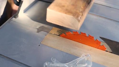 Wood Block Being Cut By Power Saw