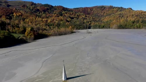 Aerial View of a Choked Church in a Decanting Lake, Industrial Mining Landscape