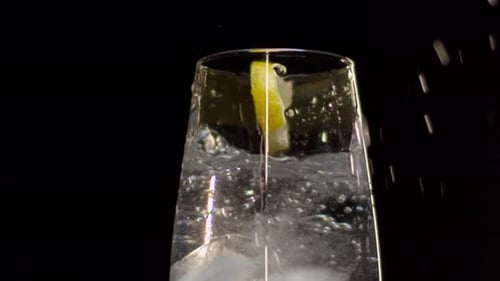 Carbonated Water with Ice and Lemon Wedge