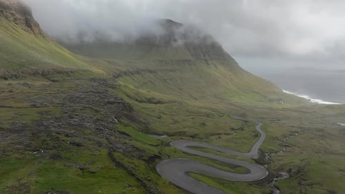 Winding mountain road aerial view in Faroe Islands