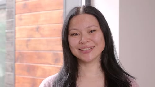 Smiling Woman Close Up in Bright Room