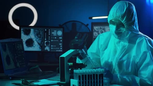 Scientist in Clean Suit Conducts Lab Research