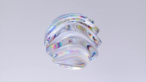 La esfera vítrea con superficie iridiscente se transforma y gira suavemente, mostrando un fascinante juego de