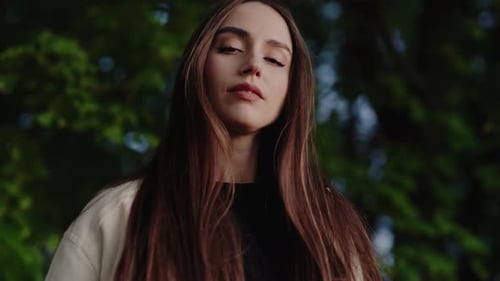 Elegant Young Woman Posing with Long Brown Hair