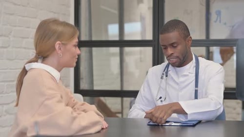 Doctor Consulting with Patient in Modern Office