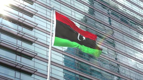 Libya Flag Waving in Front of Modern Glass Building 3D Animation
