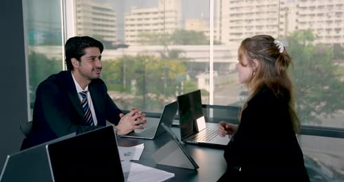 Business Professionals Meeting with Handshake in Office