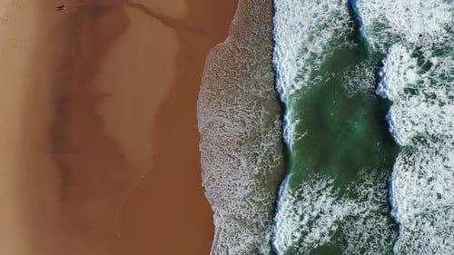 Tropical beach aerial view, Top view of waves break on tropical yellow sand beach. Sea waves seamles