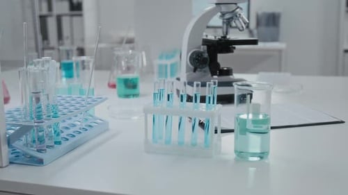 Laboratory Equipment with Test Tubes and Microscope