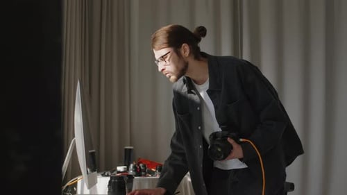 Studio Photographer Checking Photos on Computer Monitor