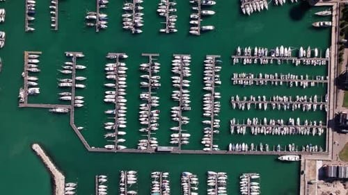 Aerial Drone View of Luxury Yachts and Boats Moored in a Coastal Marina
