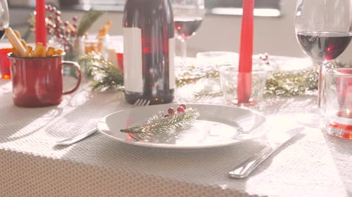 Festive Table Setting with Wine and Breadsticks