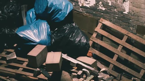 Discarded Trash and Cardboard in Dark Alley Footage