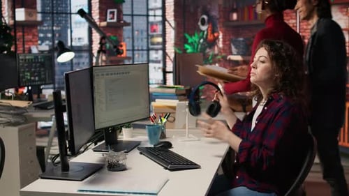 Woman Works at Computer in a Modern Office
