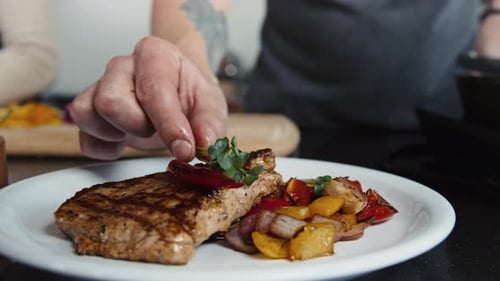 Steak and Vegetables are Plated in Kitchen