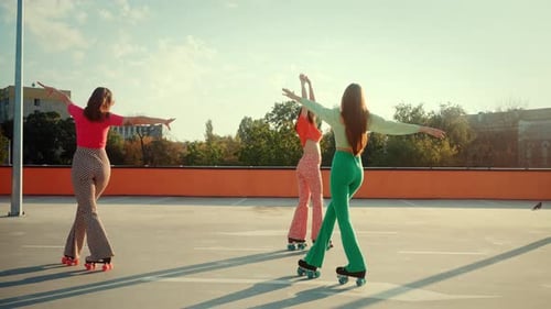 Stylish Women Roller Skating on Rooftop
