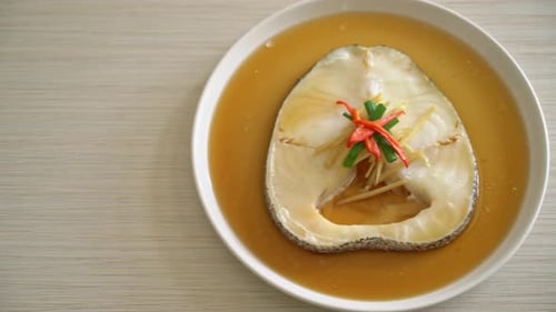 Steamed Fish with Sauce on a White Plate