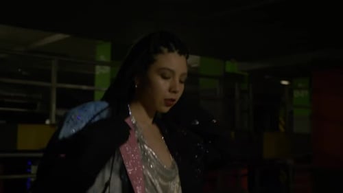 Stylish Woman Posing in Dark Parking Garage
