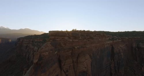Majestic Sunrise Over Moab Canyon: A Serene Desert Landscape at Dawn