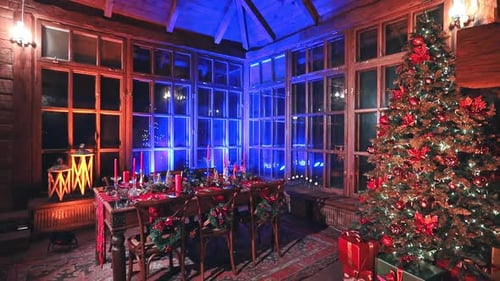 Indoor Christmas holiday celebration. Christmas table design. Full length view.