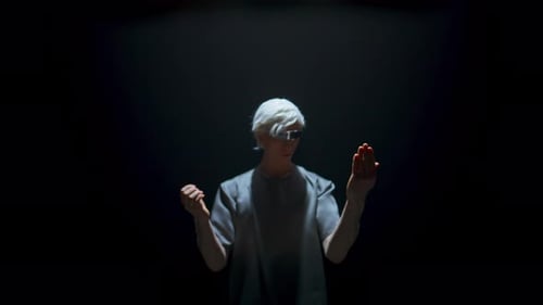 Man Using VR Headset in Dark Environment