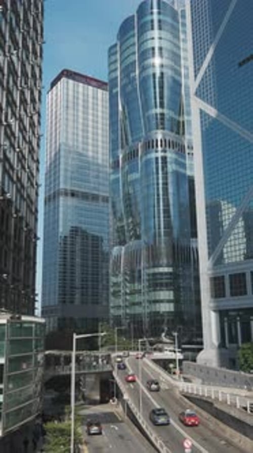 Modern skyscrapers reflect city skyline in bright daylight