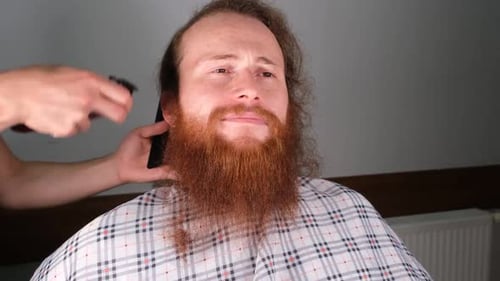 Man Getting Beard Trimmed with Clippers