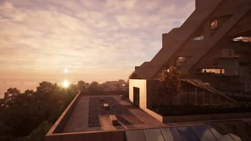 Una colorida puesta de sol sobre una azotea con un banco en primer plano