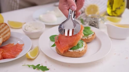 Preparing Open Faced Salmon and Spinach Sandwich