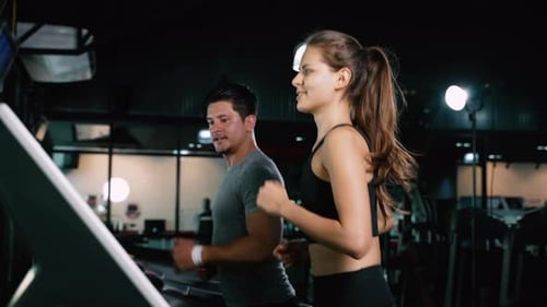 Sporty Group Running Cardio on Treadmills Exercise Burning Calorie in Fitness Gym Fit Body