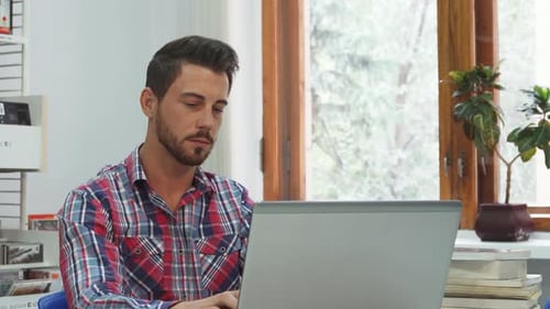 Attentive Student Takes a Moment to Rest Between Focused Study Sessions