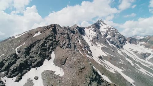 Aerial Closeup of Picturesque Snow Capped Peaks of Cheget Mountain North Caucasus Breathtaking