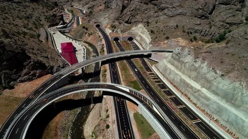 Aerial View of Highway Tunnels and Interchange in Mountainous Area