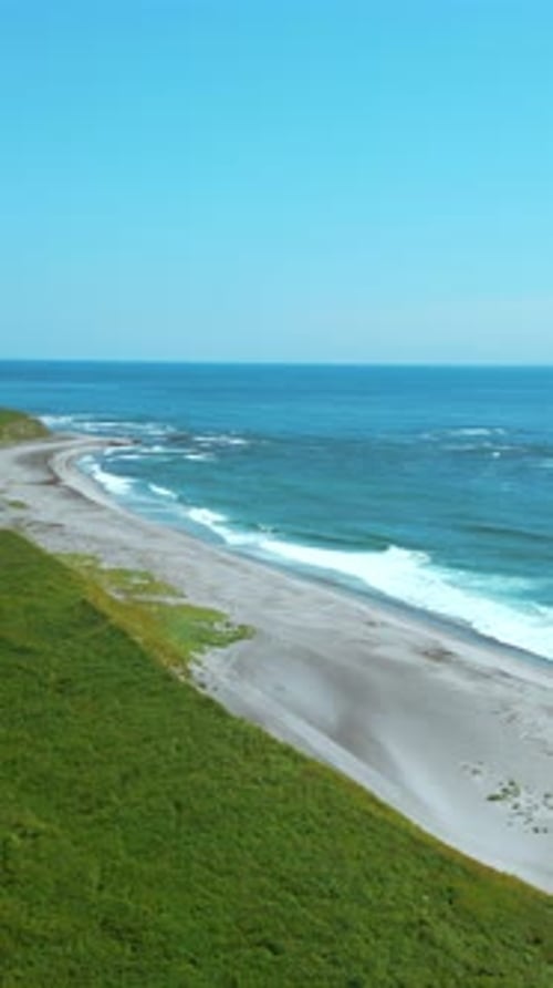 Breathtaking Aerial View of the Summer Beach Coastline Clip Wild Empty Sea Shore and Green Fields