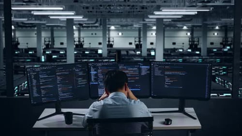 Back View Of Asian Man Developer Having Headache While Write Code In Data Center